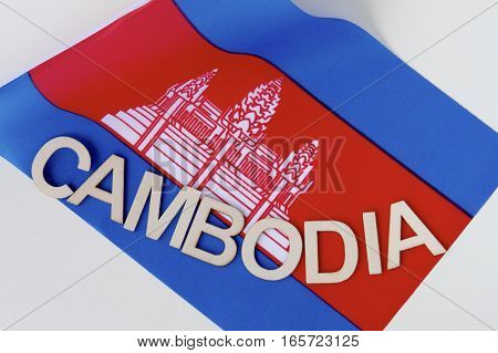 Cambodian signage on a fluttering Cambodian flag.