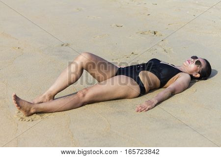 Lady body sexy relax on sand in Ban Krut Beach at Prachuap Khirikhun Province Thailand