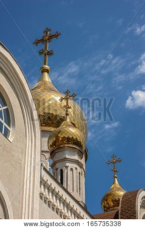 The gilt dome of an Orthodox church Dmitri Rostovsky in Rostov -on-Don Russia . The bright blue sky of May .