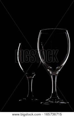 Empty two wine glass on black background