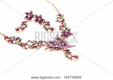 Stylish necklace and earrings isolated on white background.
