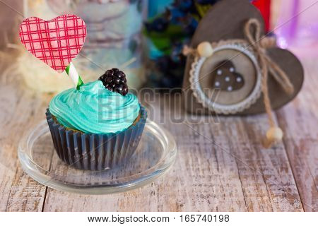 Vanilla cupcakes with decorative heart. There is a place for the text