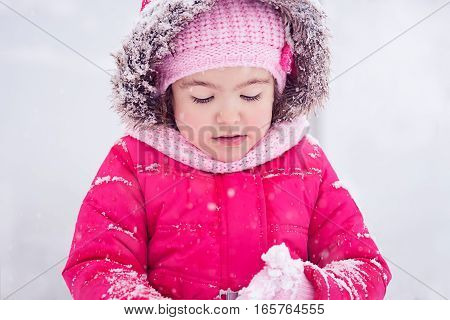 Snow Fairytale with little girl in the park