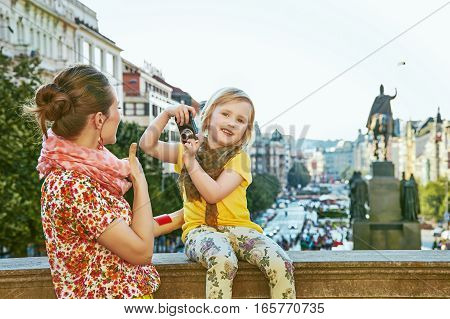 Mother And Child Travellers With Digital Camera Taking Photo
