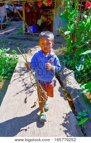 Kayan Boy In A Long-neck Hill Village In Thailand