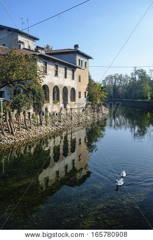 Country house along the Naviglio Grande of Turbigo (Milan Lombardy Italy) at fall with geese