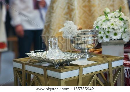 Church supplies for baptism on the table. Ceremony in Christian Church. Interior Of Orthodox Church