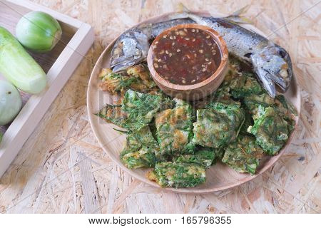 Fried acacia pennata omelet with sauce of shrimp paste and chili (Nam prik kapi) and fried mackerel Thai Cuisine