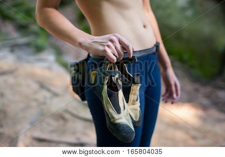 Woman Climber Holding Climbing Shoes