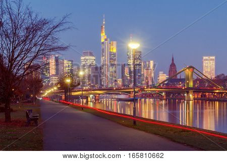 Picturesque views of the city's waterfront and skyscrapers at night in Frankfurt. Germany.