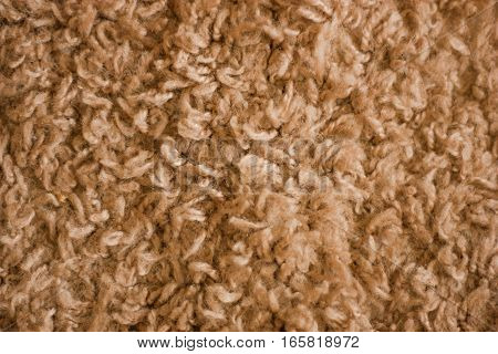 Background beige carpet close-up with a big pile