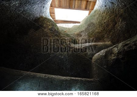 stairs leading up from an underground tomb to surface in Tierradentro Colombia