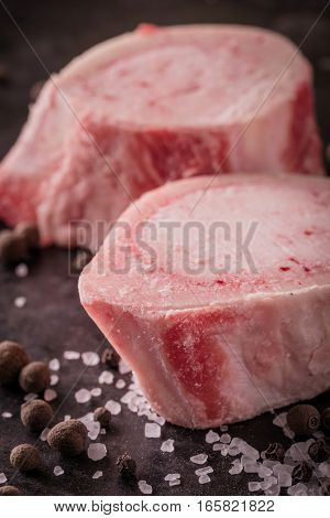 Two Slices Of Marrowbone On Dark Board