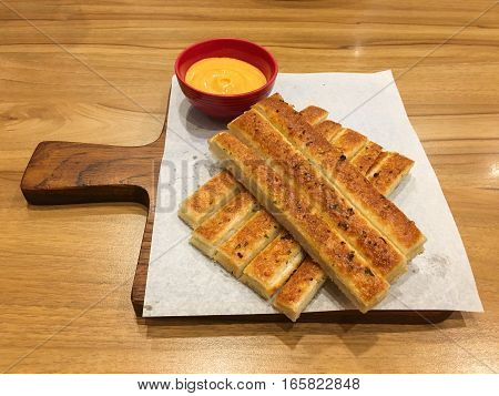 Homemade Cheesy Breadsticks with Marinara Sauce for Dipping