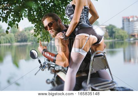 Portrait Of Sexy Couple Of Bikers On The Motorcycle