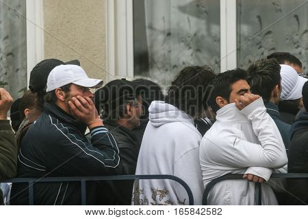Cretesti Ilfov County Romania December 6 2009: People standing in a queue to vote in Cretesti Ilfov County.