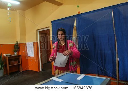 Sintesti Ilfov County Romania December 6 2009: A gypsy woman is voting for presidential elections in Sintesti Ilfov County.