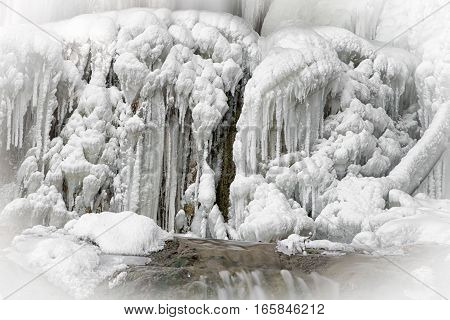 Big icicles on icefall during hard winter