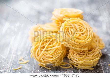 raw pasta noodles cooking on a table