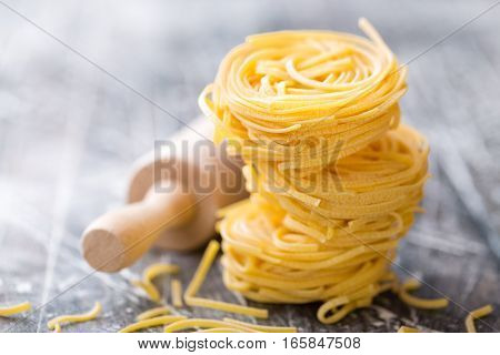 raw pasta noodles cooking on a table