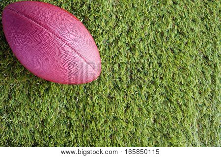 Vintage football over grass seen from above