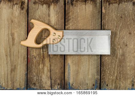 Tenon Saw On Wooden Backdrop