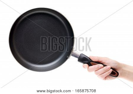 Hand holding frying pan isolated on a white background
