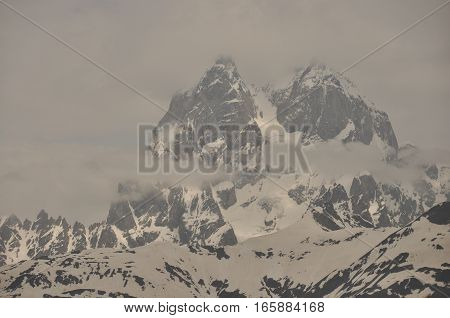 Ushba peak in the Caucasus Mountains. Snowy playing.