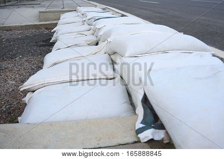 The packing sacks of sand using a stacking to prevent flooding into homes.