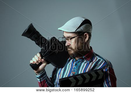 Man Retro Movie Camera And Clapper