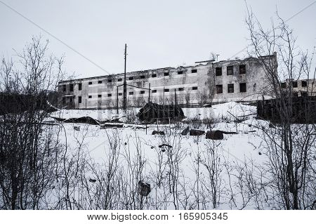Exterior of old decayed abandoned prison in Kolyma