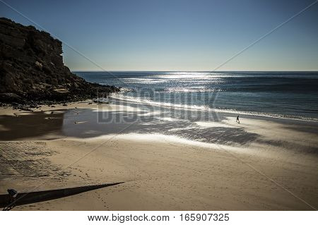 Walking along the coastline in Algarve, Portugal