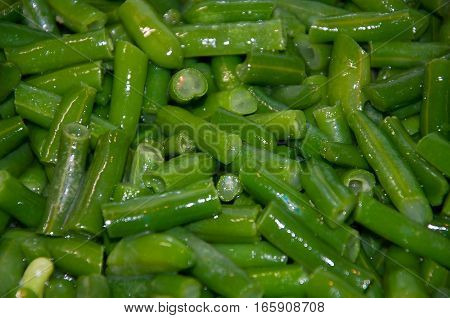 green beans in oil in the pan fried. garnish. appetizer.