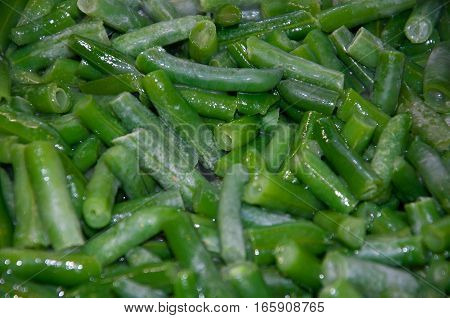 frozen green beans in oil in the pan fried. garnish. appetizer.