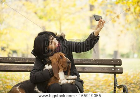 The woman with a dog in the park Selective focus and small depth of field lens flare