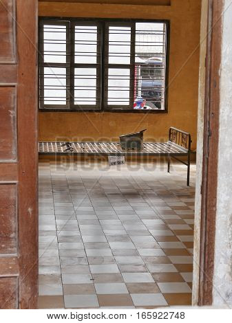 metal bed in one of the former torturing cells and a metal canister