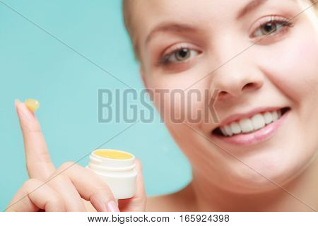 Woman Applying Balsam For Lips