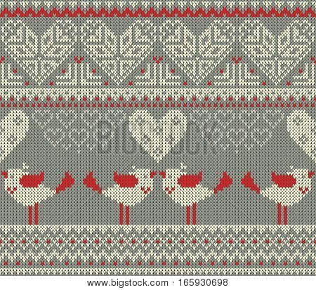 Seamless pattern on the theme of holiday Valentine's Day with an image of the Norwegian and fairisle patterns. Heart birds in a kiss on a gray background. Wool knitted texture. Vector Illustration