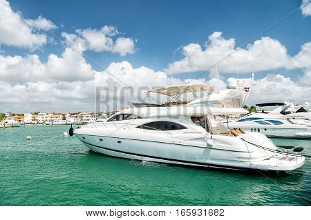 Yachts In Bay With Cloudy Sky