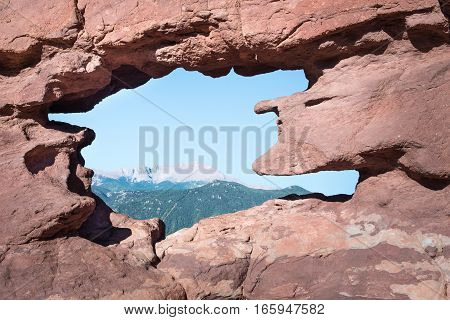 View of Pikes Peak through the Siamese Twins (a named rock formation) in Garden of the Gods, Colorado Springs, Colorado.