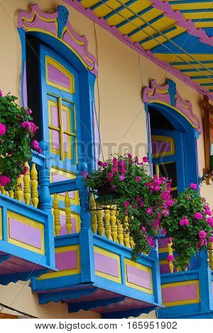 September 23, 2016 Filandia, Colombia: colonial style wooden balconies decorated with blooming flowers in the centre of the coffee producing small town