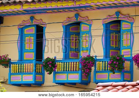 September 23, 2016 Filandia, Colombia: colourful colonial style balconies decorated with blooming flowers in the centre of the coffee producing town