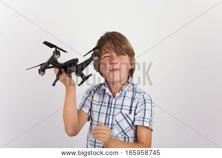 A Young boy playing with hist drone