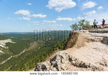 BAKHCHISARAY REPUBLIC of CRIMEA RUSSIA - SEPTEMBER 13.2016: Tourists posing against the backdrop of the mountains