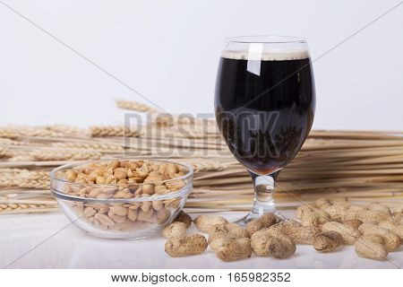 Black beer in the glass on the table Selective focus and small depth of field