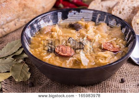 Christmas cabbage soup kapustnica with mushrooms on natural background.