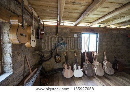July 22, 2016 San Bartolome, Ecuador: classical guitars in various finishing stages in small rural luthier shop