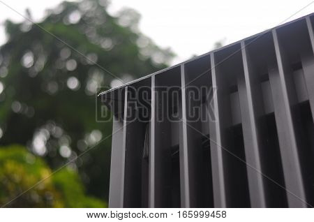 Modern facade steel edges in Architecture in dark powder coated grey.