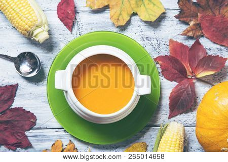 Pumpkin Soup With The Fall Leaves - Top View