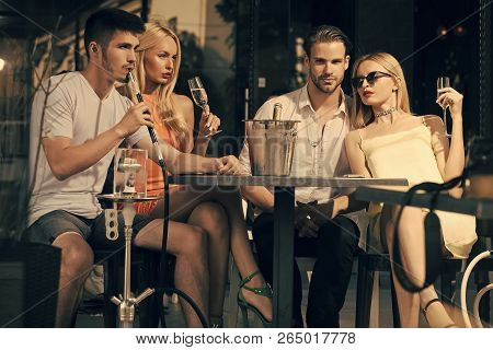 Celebration, Party Concept. Friends Vapor Hookah And Drink Alcohol In Bar Lounge. Addiction, Bad Hab